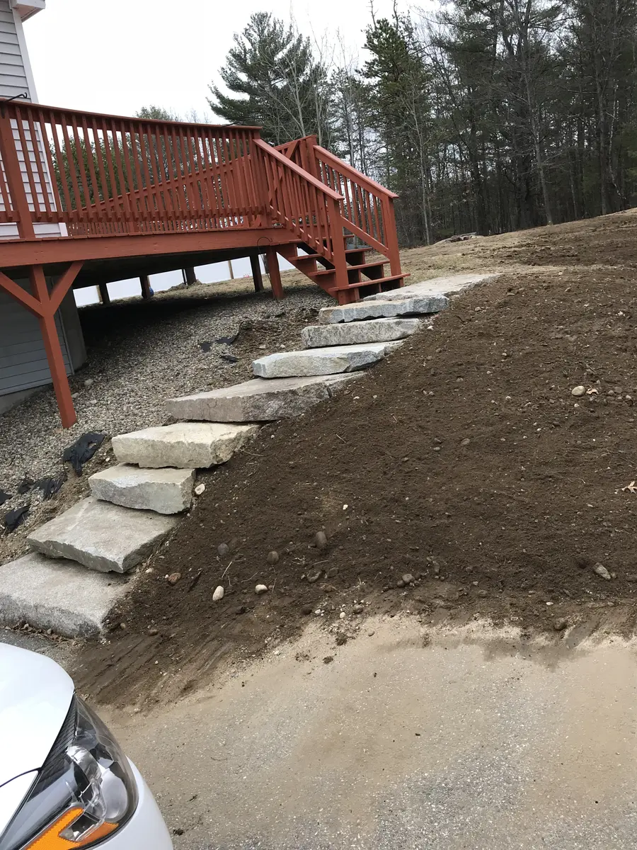 New granite steps set into a regraded and loamed slope