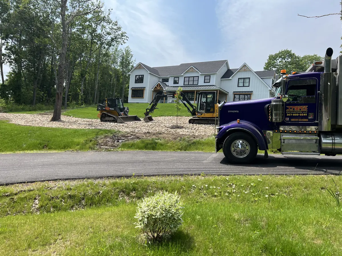 J. Mapes Excavation truck and equipment at a new home site