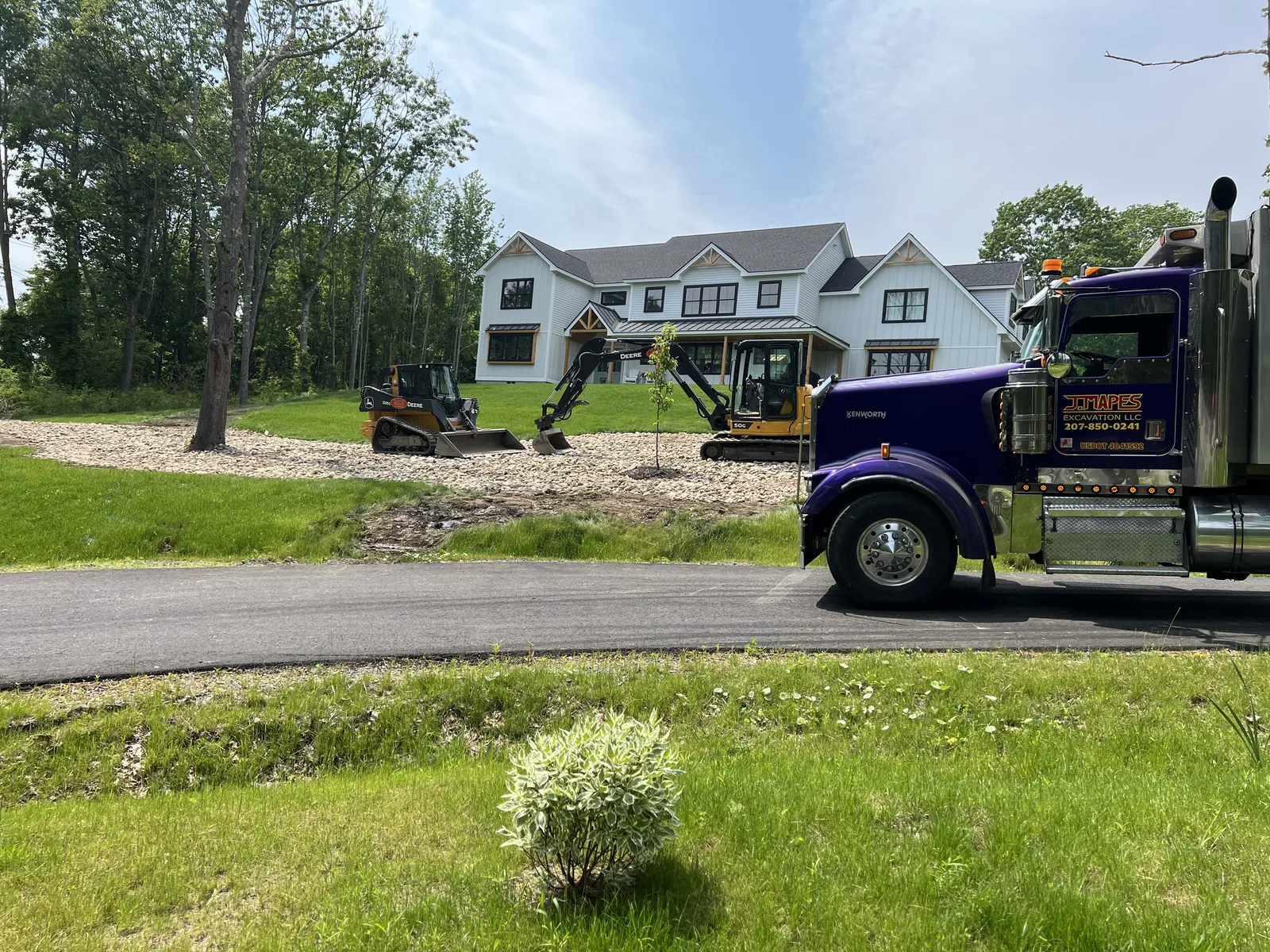 J. Mapes Excavation truck and equipment at a new home site