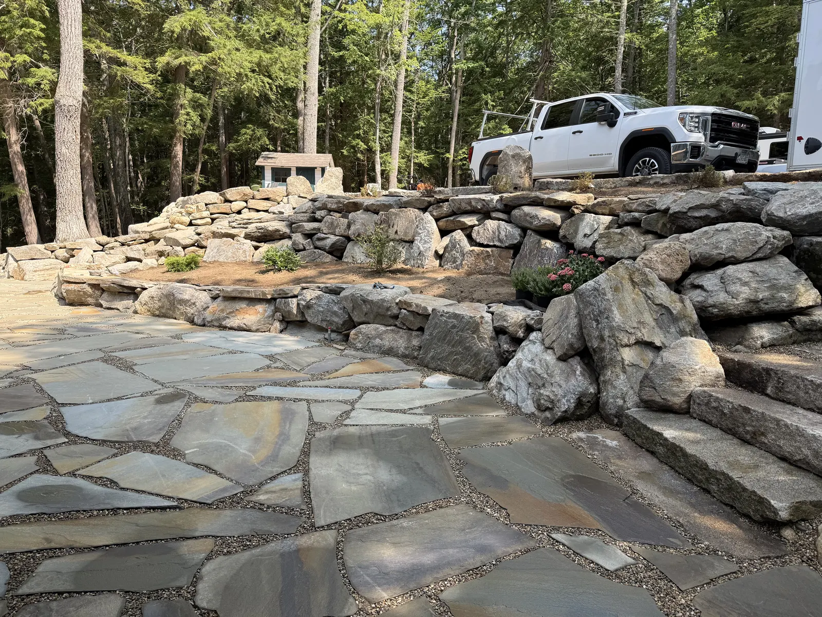 Granite steps and boulder retaining walls built by J. Mapes Excavation